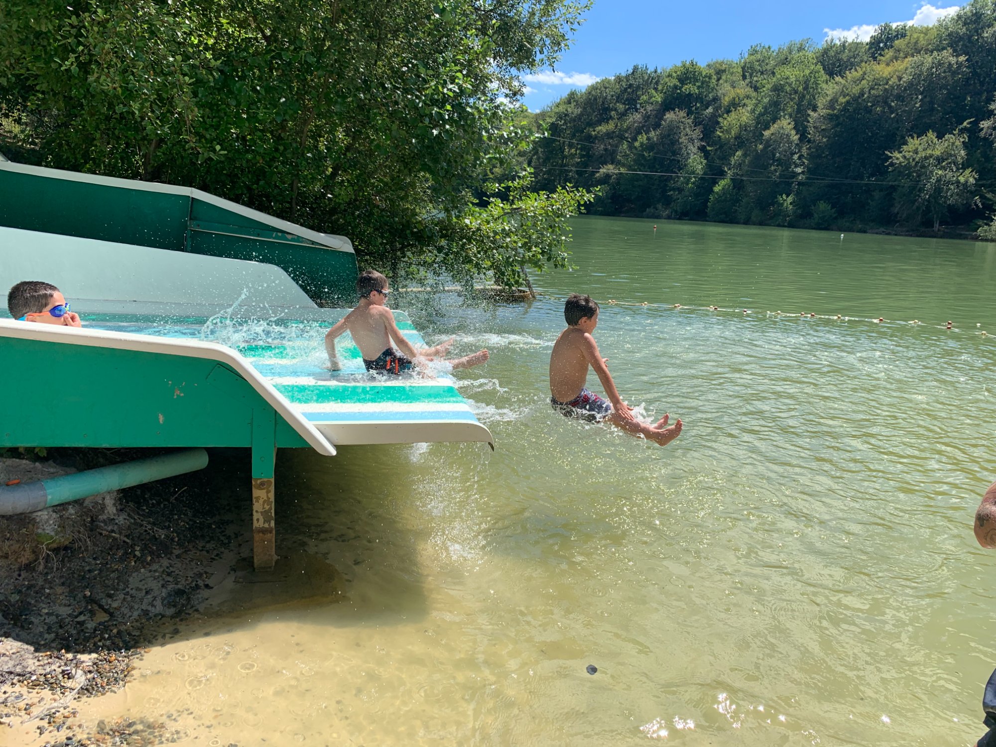 Children on the waterslide at Lac de Lupiac