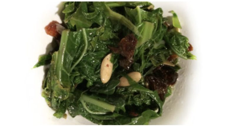 Mustard Greens with Dried Plums & Pumpkin Seeds