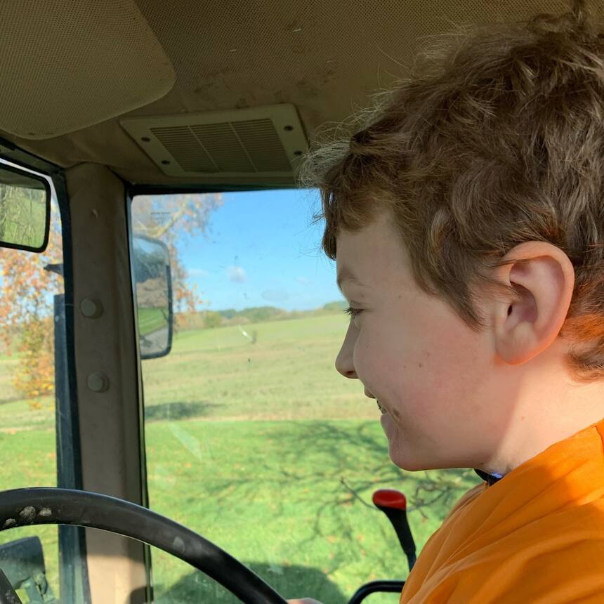 Our host took Sofian for a ride on a great big tractor and let the 9 year old dr