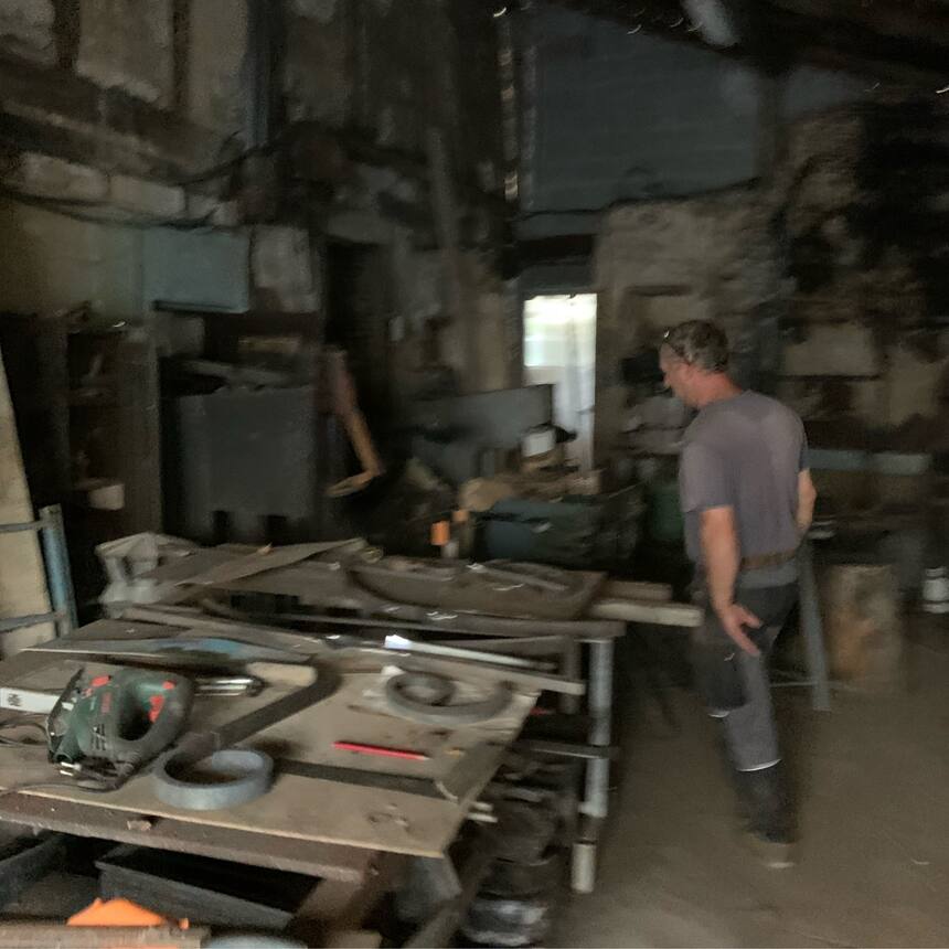 Visiting a local ferronier (blacksmith), who fixed the ironwork on our ancient f