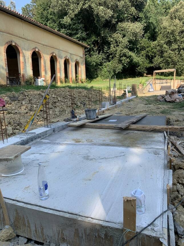 Progress!  The concrete pad for the new pool technical room is complete.