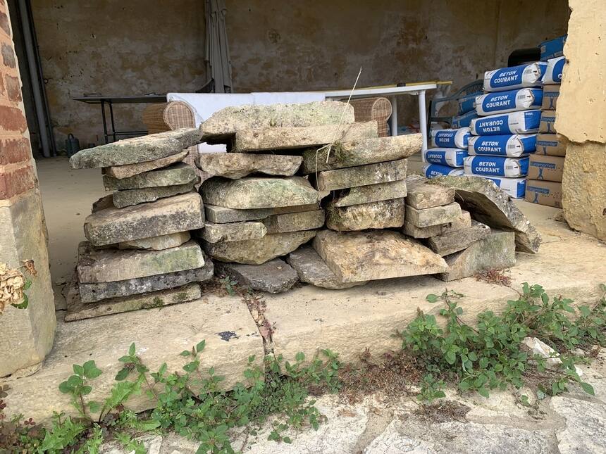 Scavenging flat stones from all of the ditches and junk piles around the propert